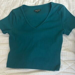 Very cute teal top!! I have never really worn it and it ties in the back.